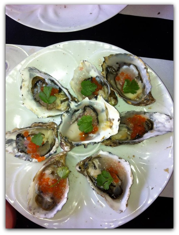 Oysters Served by Ethan and Tobias at FEAST Portland, a Northwest Culinary Event. Porcelain Oyster Plater Made by HIC.