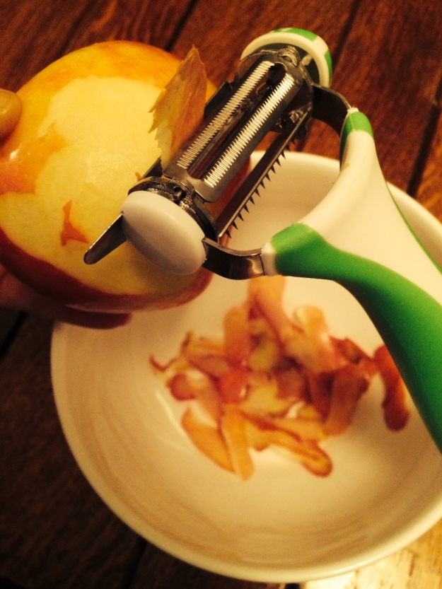 Peeling a large apple with The World's Greatest 3-in-1 Rotational Tri Peeleer